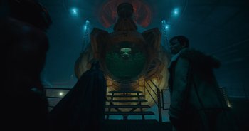 Movie still from “The Flash” (2023), directed by Andy Muschietti – A man and a woman standing in front of a building; Wide shot, Low angle