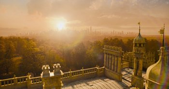 Movie still from “The Flash” (2023), directed by Andy Muschietti – The sun is setting over a city skyline; Extreme Wide shot, High angle