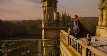 Movie still from “The Flash” (2023), directed by Andy Muschietti – A statue of a man standing on top of a building; Wide shot, Low angle