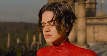 Movie still from “The Flash” (2023), directed by Andy Muschietti – A woman in a red shirt is looking to the side; Close Up shot, High angle