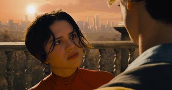 Movie still from “The Flash” (2023), directed by Andy Muschietti – A woman is looking at a man on a balcony; Close Up shot, Over the shoulder angle