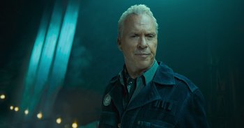 Movie still from “The Flash” (2023), directed by Andy Muschietti – An older man in a jacket and a tie; Close Up shot, Low angle