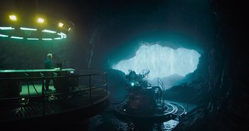Movie still from “The Flash” (2023), directed by Andy Muschietti – A boat in the middle of an underwater cave; Extreme Wide shot, Low angle