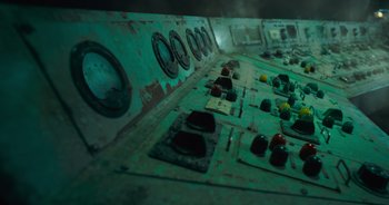 Movie still from “The Flash” (2023), directed by Andy Muschietti – A view of the control panel of an old ship; Extreme Wide shot, Overhead angle
