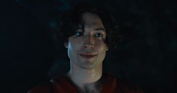 Movie still from “The Flash” (2023), directed by Andy Muschietti – A person wearing a red shirt; Close Up shot, Low angle