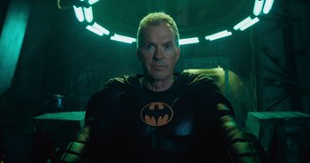 Movie still from “The Flash” (2023), directed by Andy Muschietti – A person wearing a batman costume; Medium shot, Low angle