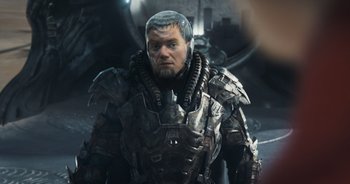 Movie still from “The Flash” (2023), directed by Andy Muschietti – A person wearing a suit of armor; Close Up shot, Over the shoulder angle