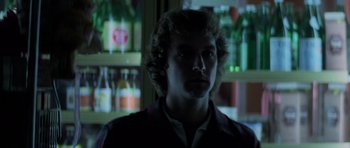 Movie still from “The Fog” (1980), directed by John Carpenter – A young man is standing in front of a window; Close Up shot, Low angle