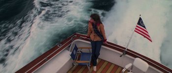 Movie still from “The Fog” (1980), directed by John Carpenter – A woman standing on the deck of a boat in the water; Wide shot, High angle