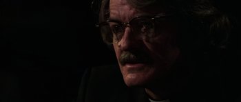 Movie still from “The Fog” (1980), directed by John Carpenter – An older man wearing glasses and a white shirt; Close Up shot, Low angle