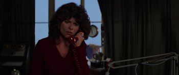Movie still from “The Fog” (1980), directed by John Carpenter – A woman holding a phone up to her ear; Close Up shot, Low angle