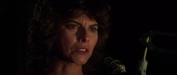 Movie still from “The Fog” (1980), directed by John Carpenter – A person with a microphone; Close Up shot, Low angle