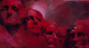 Movie still from “The Forever Purge” (2021), directed by Everardo Gout – A painting of two faces in a red background; Extreme Wide shot, Low angle