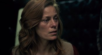 Movie still from “The Forever Purge” (2021), directed by Everardo Gout – A person with long red hair; Close Up shot, Over the shoulder angle