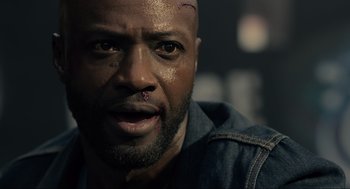 Movie still from “The Forever Purge” (2021), directed by Everardo Gout – A person with a piercing on his ear; Close Up shot, Low angle