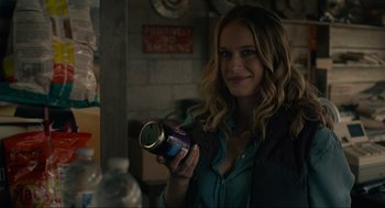 Movie still from “The Forever Purge” (2021), directed by Everardo Gout – A woman is holding a can in her hand; Close Up shot, Over the shoulder angle