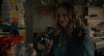 Movie still from “The Forever Purge” (2021), directed by Everardo Gout – A woman holding a can of soda in her hand; Close Up shot, Over the shoulder angle