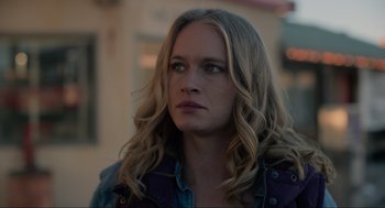 Movie still from “The Forever Purge” (2021), directed by Everardo Gout – A person with long blonde hair; Close Up shot, Low angle