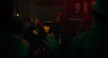 Movie still from “The Forever Purge” (2021), directed by Everardo Gout – A man and a woman standing next to each other in the dark; Medium shot, Over the shoulder angle