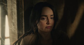 Movie still from “The Forever Purge” (2021), directed by Everardo Gout – A person with long black hair; Close Up shot, Over the shoulder angle