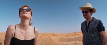 Movie still from “The Forgiven” (2021), directed by John Michael McDonagh – A woman standing in the middle of the desert; Medium shot, Low angle