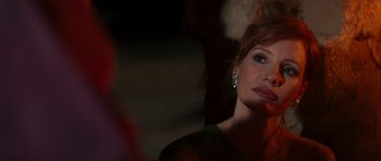 Movie still from “The Forgiven” (2021), directed by John Michael McDonagh – A person wearing a green shirt; Close Up shot, Over the shoulder angle