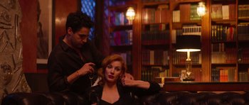 Movie still from “The Forgiven” (2021), directed by John Michael McDonagh – A woman getting her hair done by a stylist; Medium shot, Over the shoulder angle