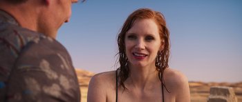 Movie still from “The Forgiven” (2021), directed by John Michael McDonagh – A person with wet hair; Close Up shot, Over the shoulder angle