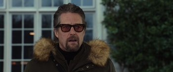 Movie still from “The Gentlemen” (2019), directed by Guy Ritchie – A person wearing a jacket; Close Up shot, Over the shoulder angle