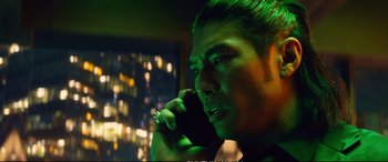 Movie still from “Deadpool 2” (2018), directed by David Leitch – A person talking on a cell phone; Close Up shot, Low angle