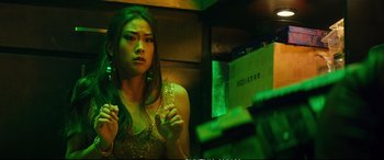 Movie still from “Deadpool 2” (2018), directed by David Leitch – A young woman is looking at herself in the mirror; Close Up shot, Over the shoulder angle