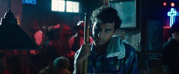 Movie still from “Deadpool 2” (2018), directed by David Leitch – A man holding a baseball bat in a room; Close Up shot, Low angle