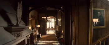 Movie still from “Deadpool 2” (2018), directed by David Leitch – A long hallway with lamps , a fireplace , and a large window; Extreme Wide shot, High angle