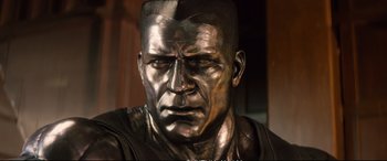 Movie still from “Deadpool 2” (2018), directed by David Leitch – A statue of a man's face; Close Up shot, Low angle