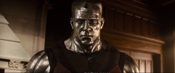 Movie still from “Deadpool 2” (2018), directed by David Leitch – A statue of a man with a helmet on; Close Up shot, Low angle