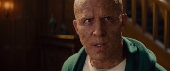 Movie still from “Deadpool 2” (2018), directed by David Leitch – An old man with a shaved head and a bald head; Close Up shot, Low angle