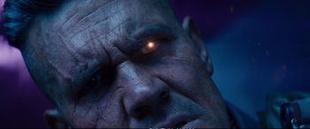 Movie still from “Deadpool 2” (2018), directed by David Leitch – An old man with a glowing eye staring at the camera; Extreme Close Up shot, Low angle