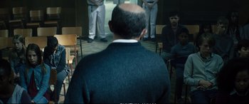 Movie still from “Deadpool 2” (2018), directed by David Leitch – A group of people sitting in a room; Medium shot, Over the shoulder angle