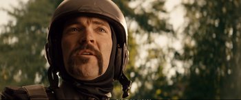 Movie still from “Deadpool 2” (2018), directed by David Leitch – A person wearing a motorcycle helmet; Close Up shot, Over the shoulder angle