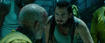 Movie still from “Deadpool 2” (2018), directed by David Leitch – A person with a face tattoo; Close Up shot, Over the shoulder angle