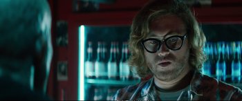 Movie still from “Deadpool 2” (2018), directed by David Leitch – A person wearing glasses; Close Up shot, Low angle