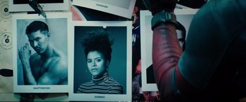 Movie still from “Deadpool 2” (2018), directed by David Leitch – A picture of a woman in a black and white striped shirt; Close Up shot, Low angle