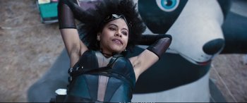 Movie still from “Deadpool 2” (2018), directed by David Leitch – A woman in a blue dress with a large afro; Close Up shot, Low angle