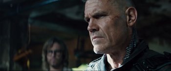 Movie still from “Deadpool 2” (2018), directed by David Leitch – A person looking at the camera; Close Up shot, Over the shoulder angle