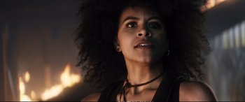 Movie still from “Deadpool 2” (2018), directed by David Leitch – A person wearing a necklace; Close Up shot, Low angle