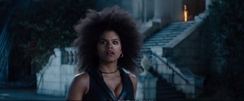 Movie still from “Deadpool 2” (2018), directed by David Leitch – A woman standing in front of a stone staircase; Close Up shot, Low angle