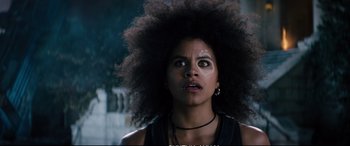 Movie still from “Deadpool 2” (2018), directed by David Leitch – A person with afro hair; Close Up shot, Low angle