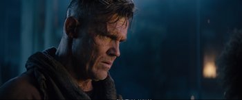 Movie still from “Deadpool 2” (2018), directed by David Leitch – A person looking down at his face; Close Up shot, Low angle