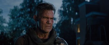 Movie still from “Deadpool 2” (2018), directed by David Leitch – A person wearing a jacket; Close Up shot, Over the shoulder angle