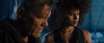 Movie still from “Deadpool 2” (2018), directed by David Leitch – A man and a woman looking at one another; Close Up shot, Low angle